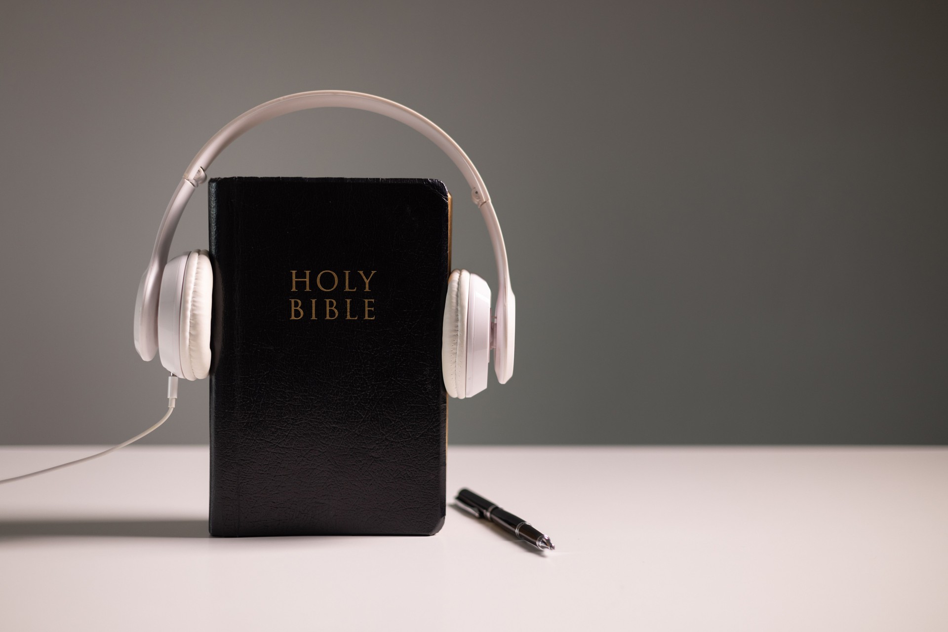 Reading the Holy Bible on a cellular device showcases how technology integrates with Christian practices, making the sacred book accessible beyond paper in both personal and business contexts.